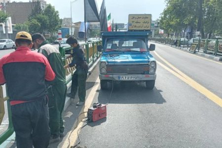 مرمت نرده های خیابان آزادی تهران پس از مراسم وداع با پیکر شهدای خدمت